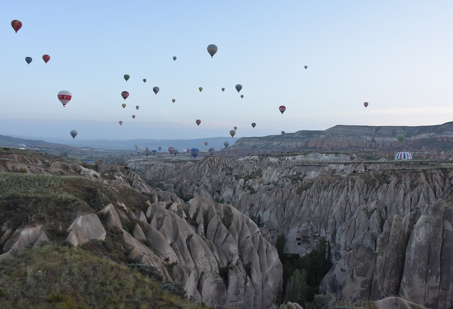 Hot-air balloons over Cappadocia at dawn